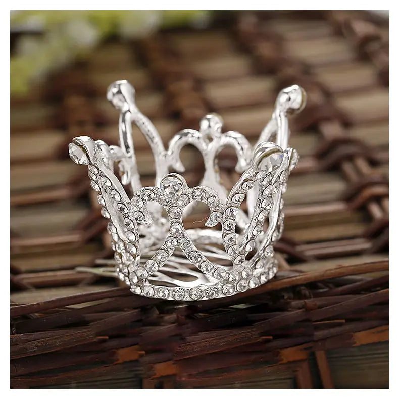 a sparkling silver childrens hair comb crown adorned with numerous clear rhinestones showcasing intricate comb crown rhinestone design in crown rhinestone accessories style