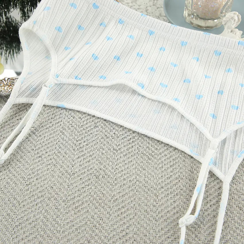 white ribbed cotton bikini bottom with light blue knitted heart printing and adjustable side ties from knitted heart printing ribbed loungewear set providing heart printing comfortable wear.