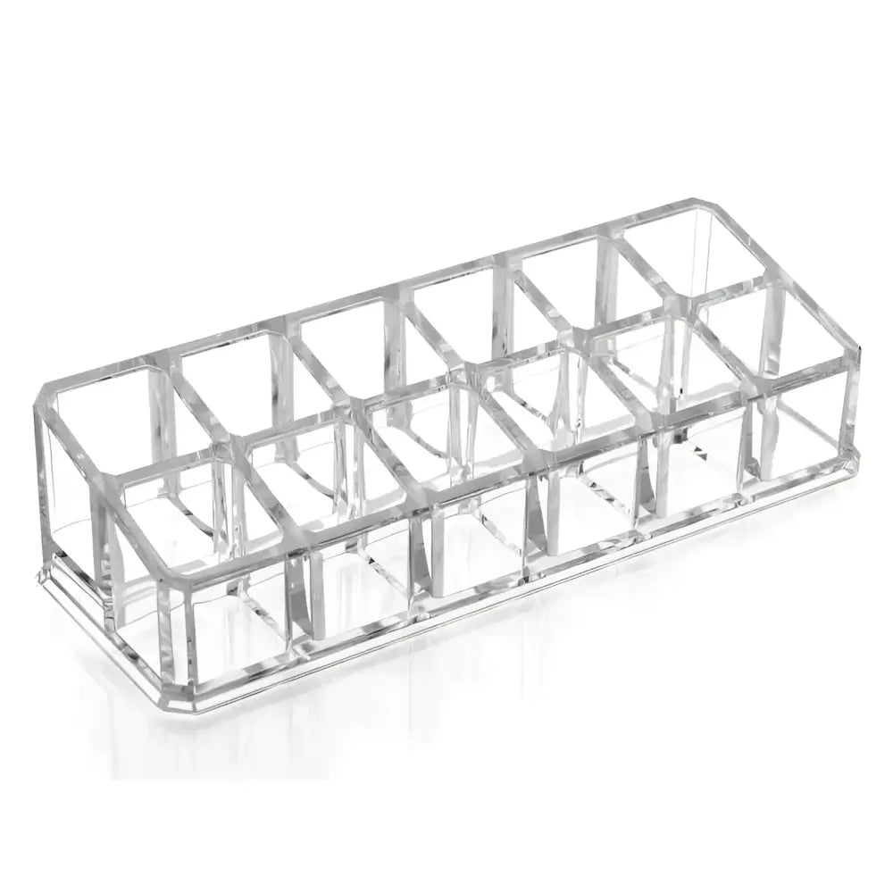 Clear acrylic makeup organizer with rectangular segmented design and compartments holding multiple cosmetic items