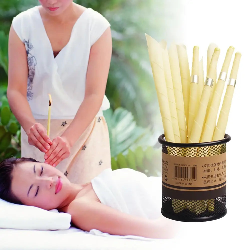 a set of pale yellow coning beewax natural ear candle incense sticks with silver bands neatly arranged in a black mesh cylindrical holder for ear healthy care and wax removal