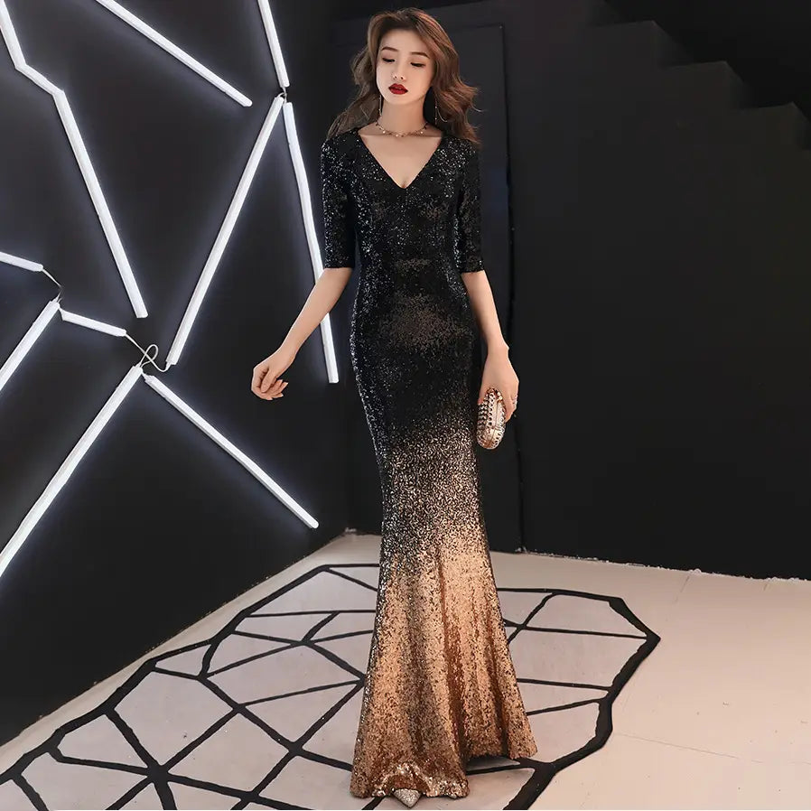Black and gold sequined mermaid gown with a v-neckline and three-quarter sleeves made of polyester fiber main fabric, perfect for a sequined annual meeting.