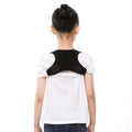 Black adjustable posture corrector support belt worn over white shirt for luxury women’s fashion and back support