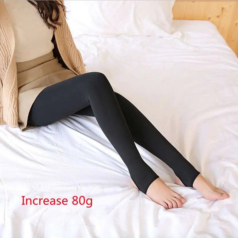 Adjustable maternity pantyhose tights in black worn by a person sitting on bed for comfortable maternity support