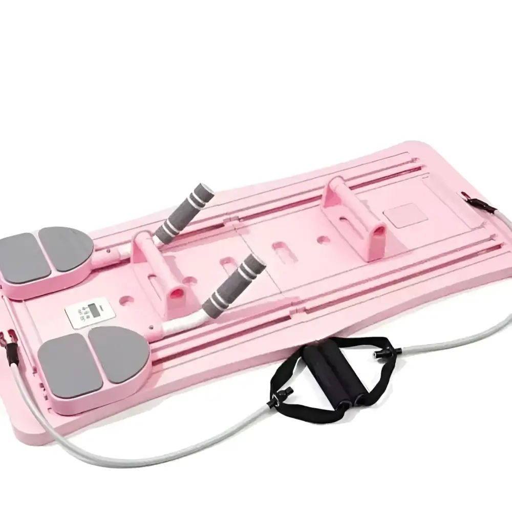 Pink adjustable pilates sliding board with gray foot pads and black resistance bands for full-body workouts