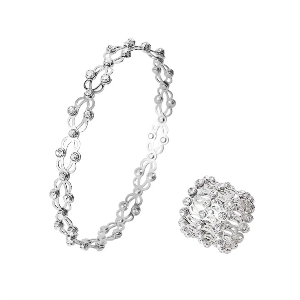 Silver-toned adjustable rhinestone bracelet and fashion rings set with intricate interlocking chain design and clear stones