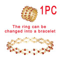 Gold-colored adjustable rhinestone bracelet and fashion rings set with red gemstones transformable into matching accessories