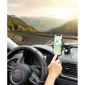 Black smartphone mounted in car phone navigation bracket with adjustable suction cup and arms on dashboard holder