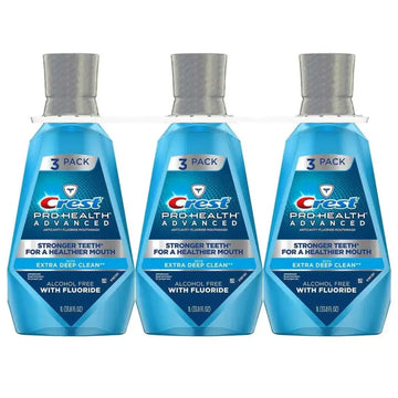 Three-pack of crest pro-health advantage mouthwash deep clean in translucent blue bottles with silver caps 33.8 oz each