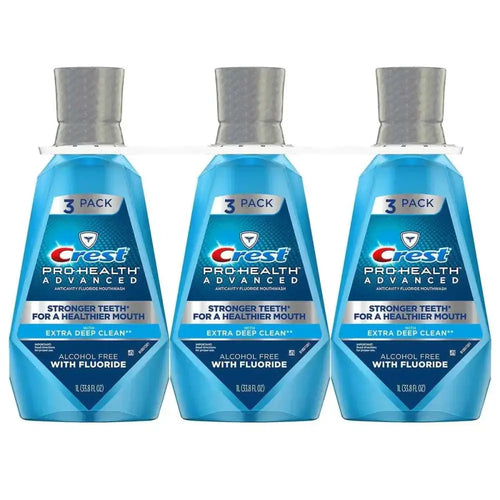 Three-pack of crest pro-health advantage mouthwash deep clean in translucent blue bottles with silver caps 33.8 oz each