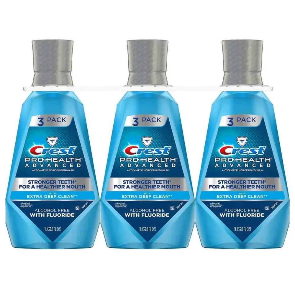 Three-pack of crest pro-health advantage mouthwash deep clean in translucent blue bottles with silver caps 33.8 oz each