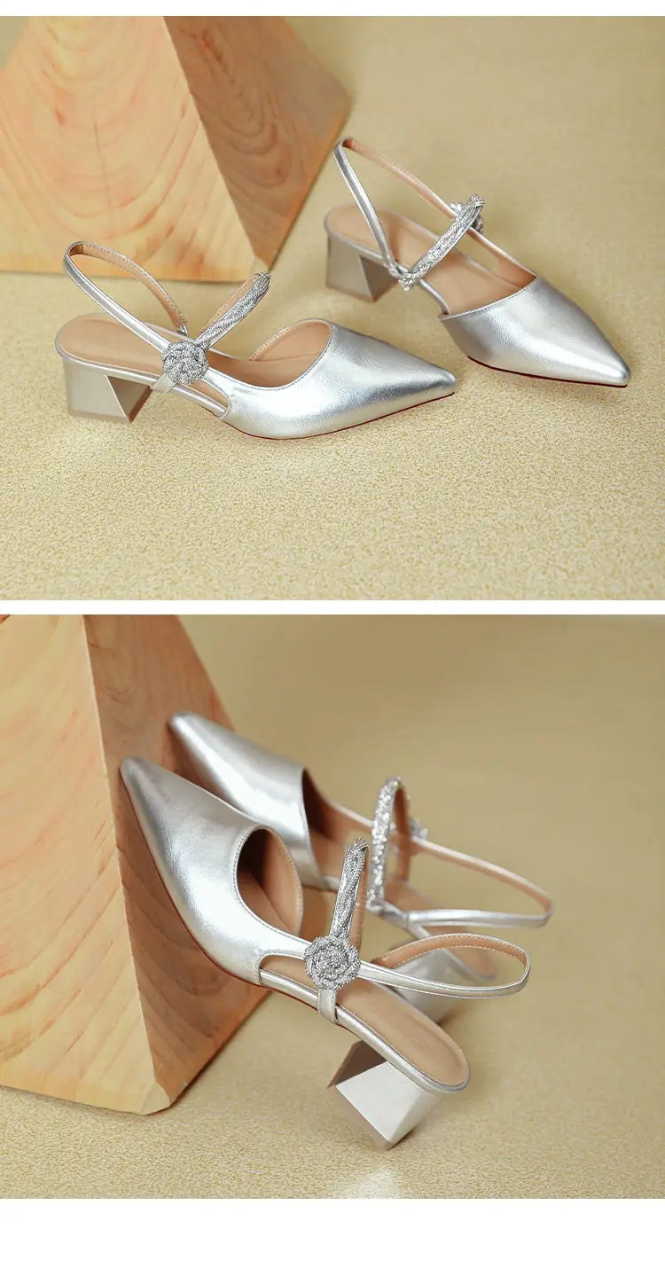 silver metallic pointed toe high heels with chunky heel and crystal-embellished ankle strap in slingback style