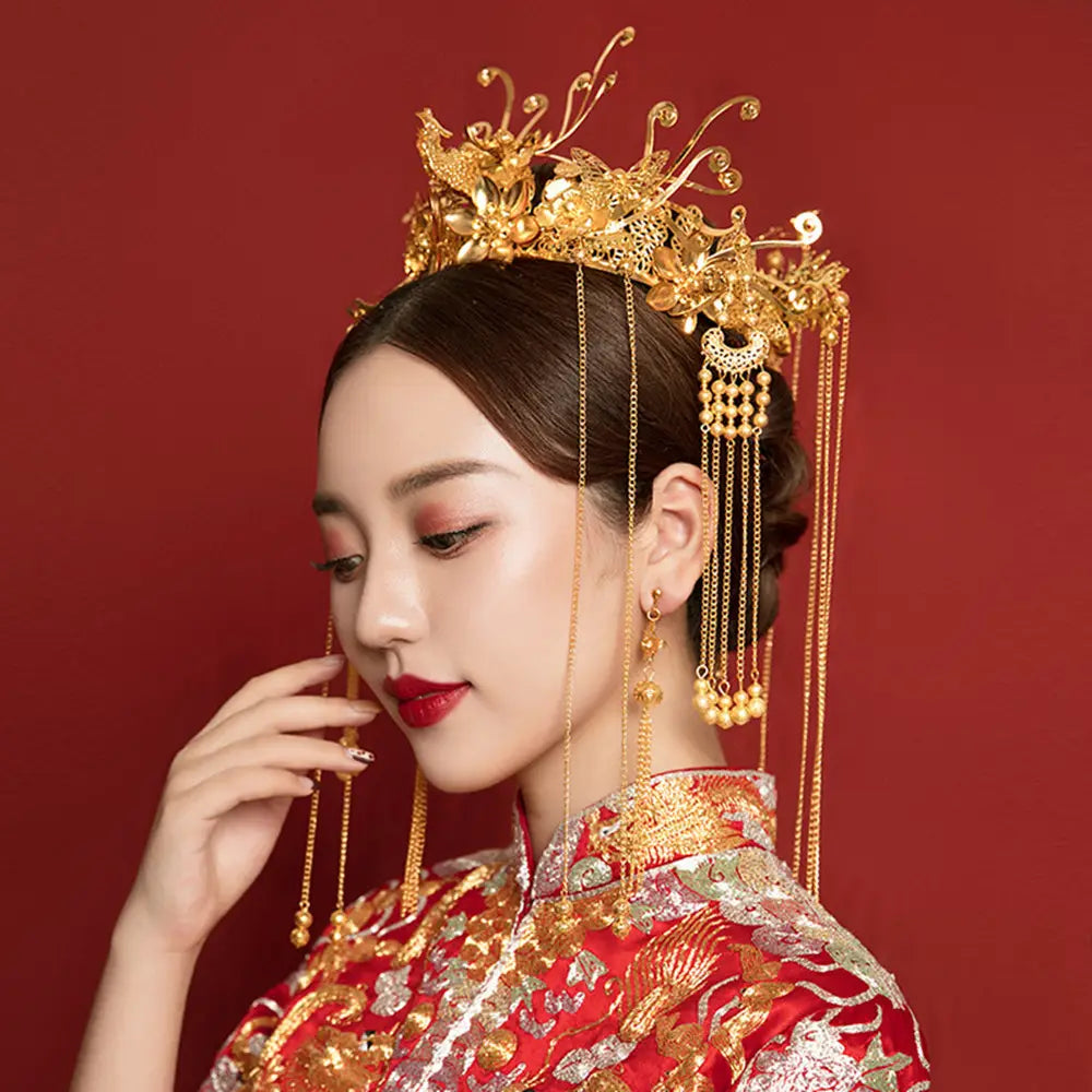 antique gold filigree bridal hair crown featuring a golden ornate hair crown with intricate phoenix and floral designs and dangling chains adorned with pearl-like beads, ideal for clothing hair accessories and antique hair accessories use.