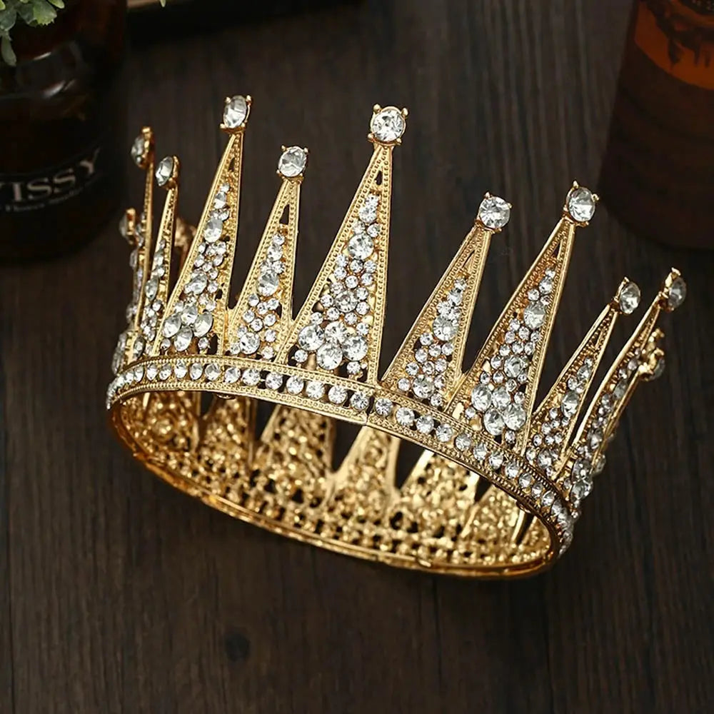A sparkling gold rhinestone fashion bridal hair alloy crown with intricate filigree detailing and numerous clear rhinestones designed as bridal hair accessories.