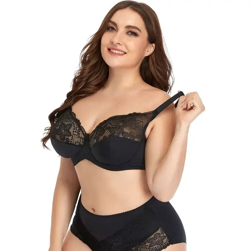plus size underwire lace trim lingerie set featuring a black lace-trimmed bra and matching high-waisted panties made from delicate lace fabric.