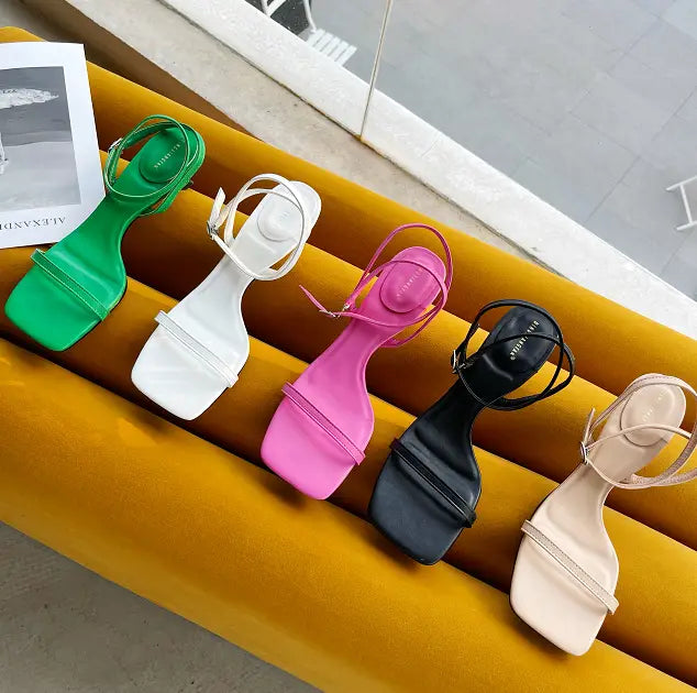 a row of five colorful square toe minimalist block heel ankle strap sandals in green, white, pink, black, and beige, highlighting the square toe design ideal for stylish summer wear.