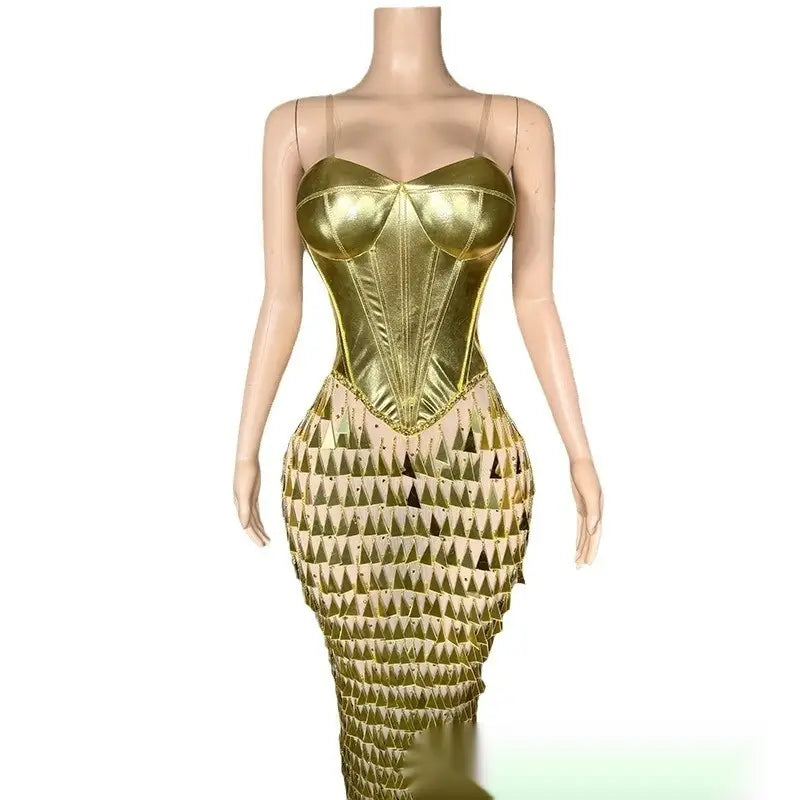 a shimmering gold metallic corset dress featuring a structured bodice and a lower section decorated with triangular sequin patterns showcasing a golden bright surface bandage metallic mermaid gown with a bright surface bandage design