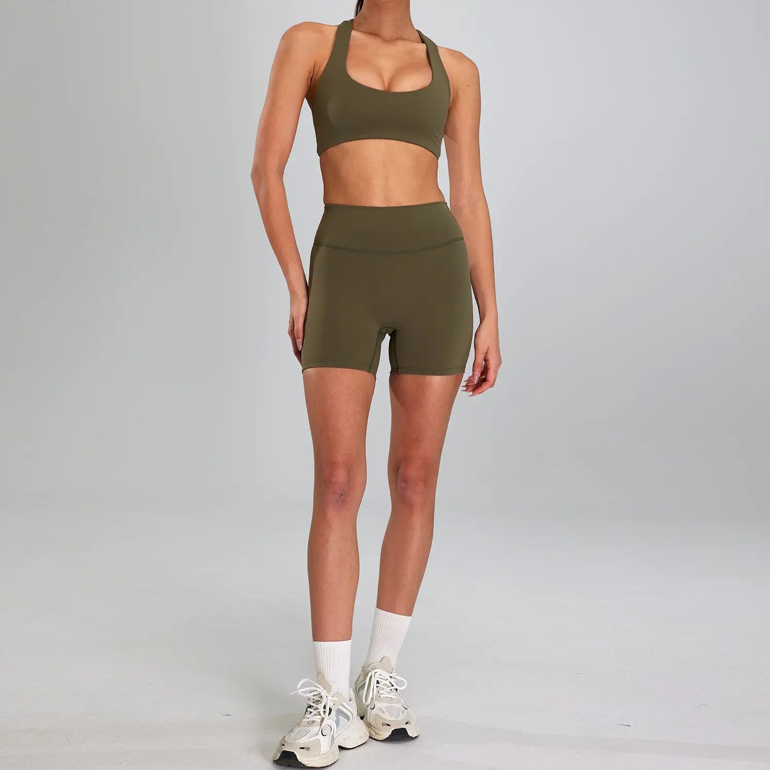 olive green seamless athletic two-piece sports suit outdoor designed for outdoor running nude activities featuring a high waist fit