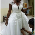 White lace african mermaid detachable wedding dress with intricate beading and flowing tulle skirt