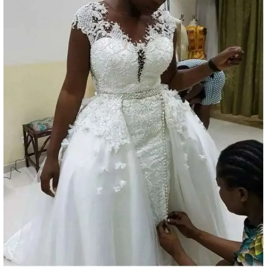 White lace african mermaid detachable wedding dress with intricate beading and flowing tulle skirt
