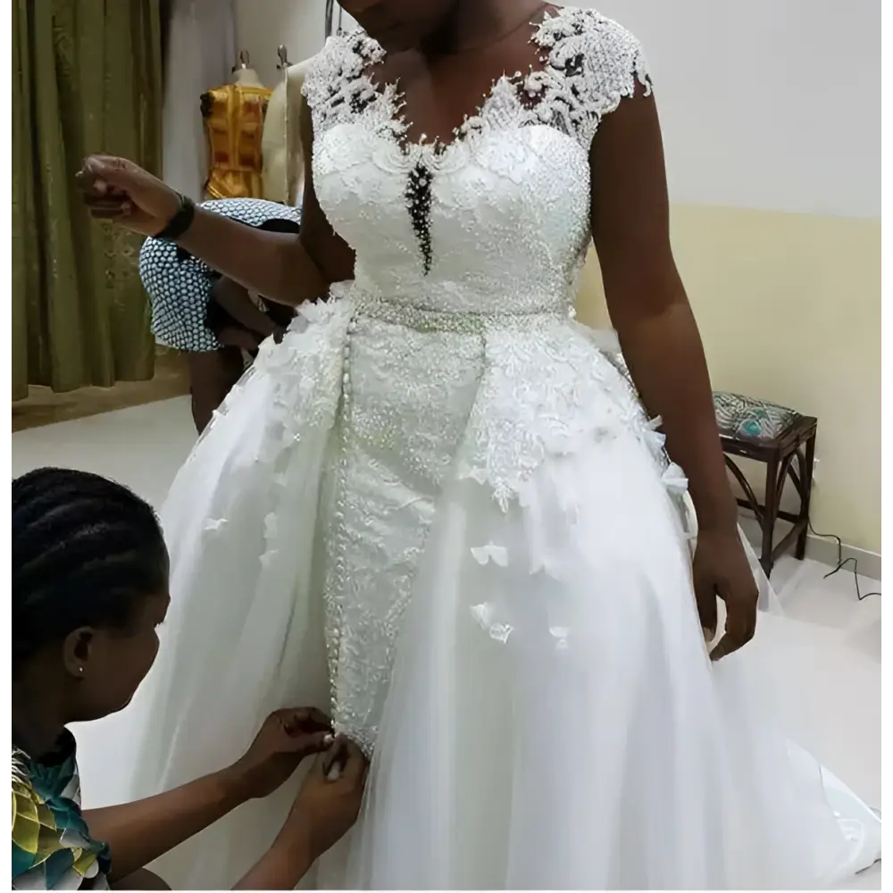 White lace african mermaid detachable wedding dress with beaded detailing and a fitted bodice for brides