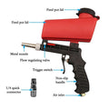 Red and black air portable sandblasting gun with metal nozzle and flow valve for brake disc paint applications