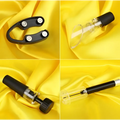 Black plastic wine opener with silver screwdriver handles and glass stopper in air pump wine opener 4-piece gift box