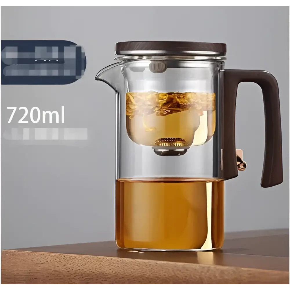 Clear all-glass heat-resistant teapot with a dark wooden handle and lid featuring an internal metal glass filter
