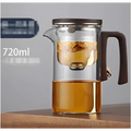 All-glass heat-resistant teapot with dark brown wooden handle and lid featuring an internal metal glass filter