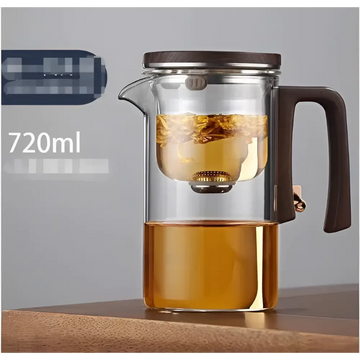 Clear all-glass heat-resistant teapot with a dark wooden handle and lid featuring an internal metal glass filter