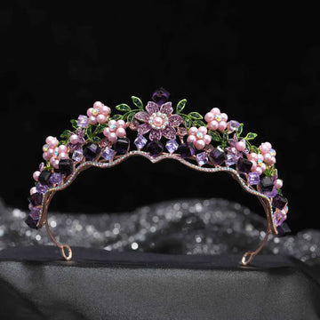 Delicate wedding bridal tiara with alloy crystal flowers, pink pearls, and green leaf accents on gold-toned metal base