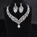 A silver-toned alloy diamond accessories set featuring a teardrop pendant choker and floral crystal drop earrings