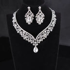 A silver-toned alloy diamond accessories set featuring a teardrop pendant choker and floral crystal drop earrings