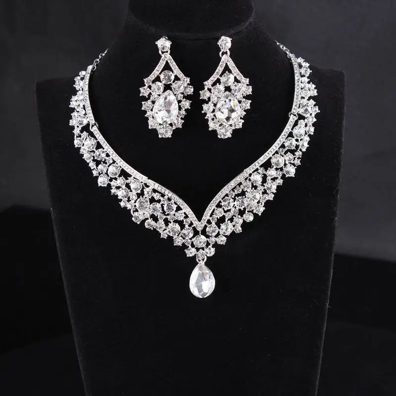 A silver-toned alloy diamond accessories set featuring a teardrop pendant choker and floral crystal drop earrings