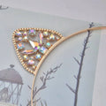 Alloy spot drill rabbit ears rhinestone headband with gold-toned metal and iridescent faceted rhinestones decoratively arranged