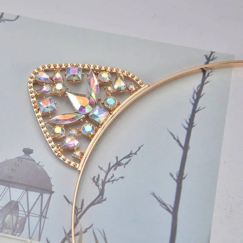 Alloy spot drill rabbit ears rhinestone headband with gold-toned metal and iridescent faceted rhinestones decoratively arranged