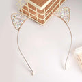 Delicate gold-toned alloy spot drill headband with sparkling rabbit ears rhinestone in triangular cat ear shapes