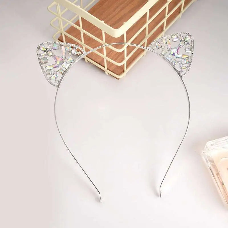 A delicate silver alloy spot drill rabbit ears rhinestone headband adorned with sparkling clear crystals
