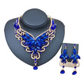 Blue butterfly-shaped necklace and earrings set with sparkling gemstones for color exaggerated bride jewelry use