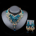Elegant turquoise and gold toned crystal choker necklace with leaf and butterfly motifs in american color exaggerated bride jewelry set