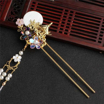 Elegant gold ancient costume hairpin adorned with white disc, iridescent gemstones, pearls, and floral hairpin accessories tassel
