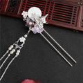 Silver ornate costume hairpin adorned with white disc floral motifs and tassel hairpin accessories pearls and beads