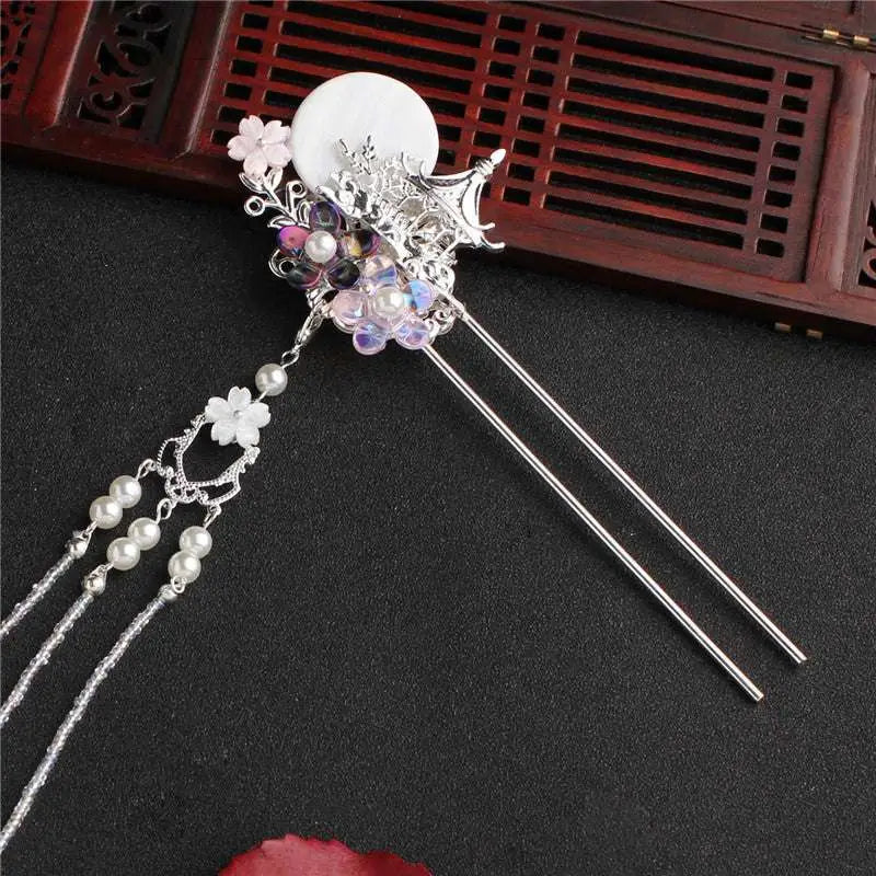 Silver ornate costume hairpin adorned with white disc floral motifs and tassel hairpin accessories pearls and beads