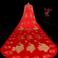 A vibrant red ancient xiuhe dress bridal cape with intricate gold peacock embroidery displayed on a mannequin