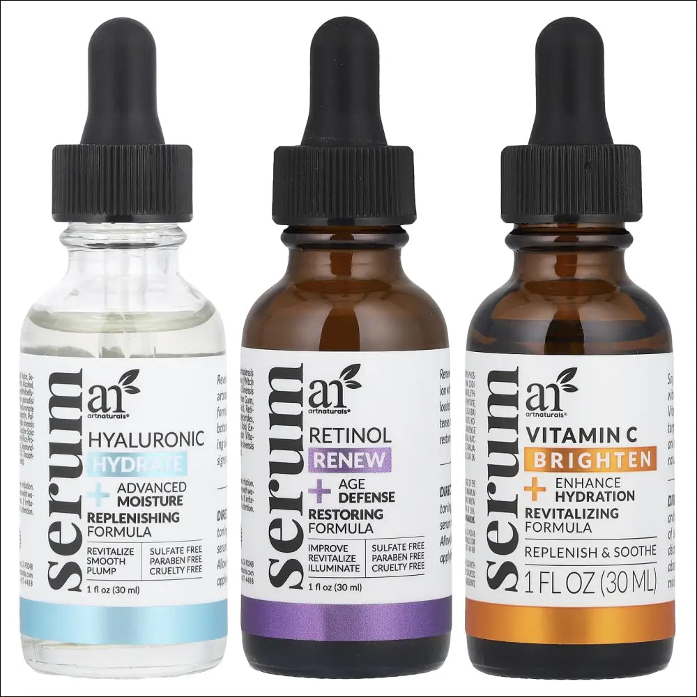 Three glass serum bottles with black droppers and colored labels in ai arn anti-aging serum item package for luxury women’s fashion