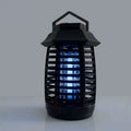 Black plastic lantern-style aromatherapy mosquito lamp with glowing blue electric uv insect lights for effective mosquito killer