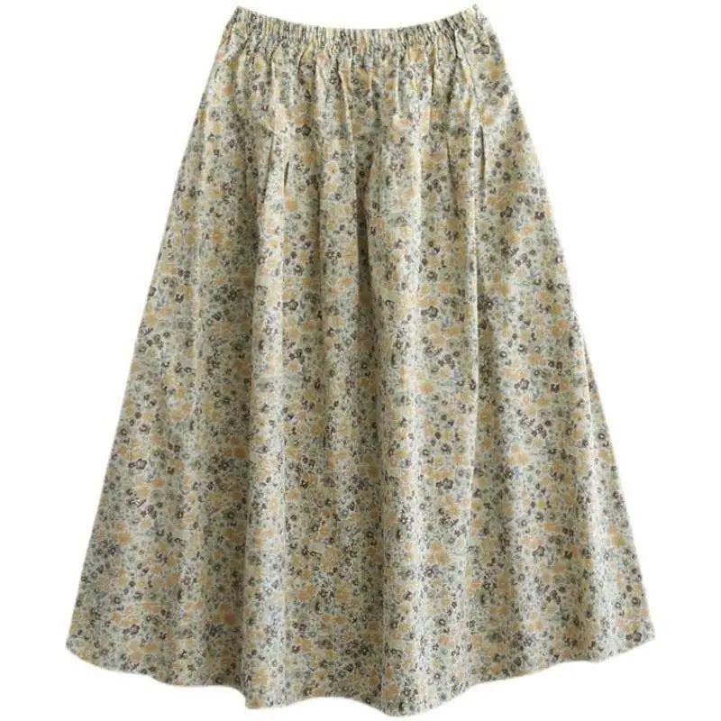 A soft flowing artistic floral washed cotton a-line midi skirt in pale cream with delicate floral pattern in yellow and gray
