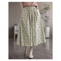 Artistic floral washed cotton midi skirt with pale green and yellow delicate floral pattern and soft gathered waistband