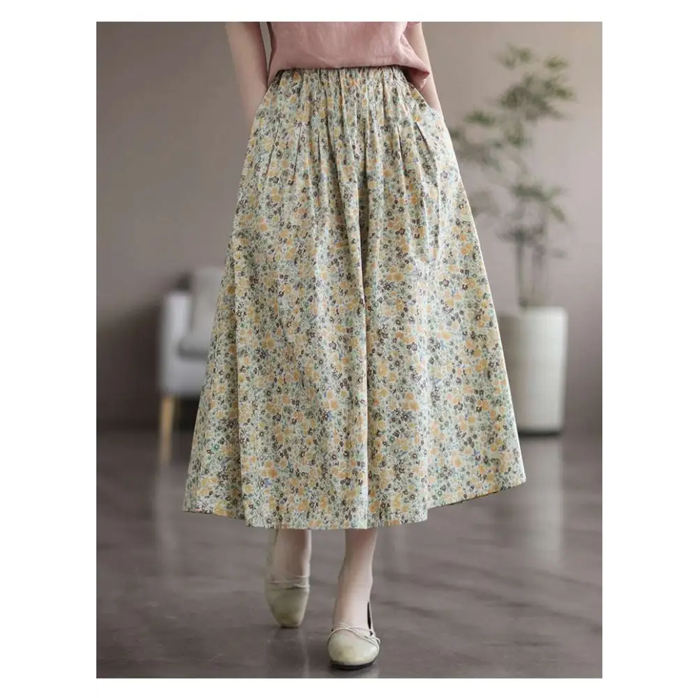 Artistic floral washed cotton midi skirt with pale green and yellow delicate floral pattern and soft gathered waistband