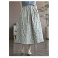 A flowing washed cotton sweet midi skirt with an artistic floral washed delicate floral pattern in soft blue and green hues