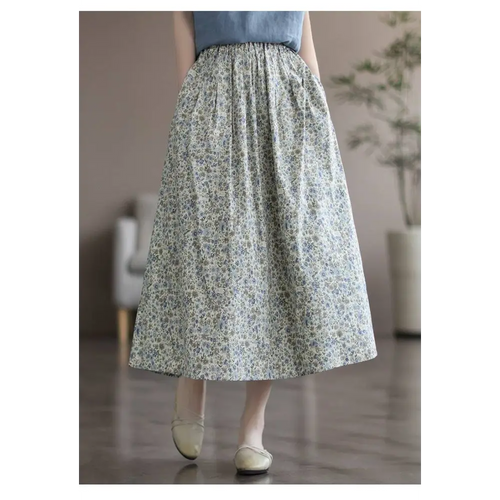A flowing washed cotton sweet midi skirt with an artistic floral washed delicate floral pattern in soft blue and green hues
